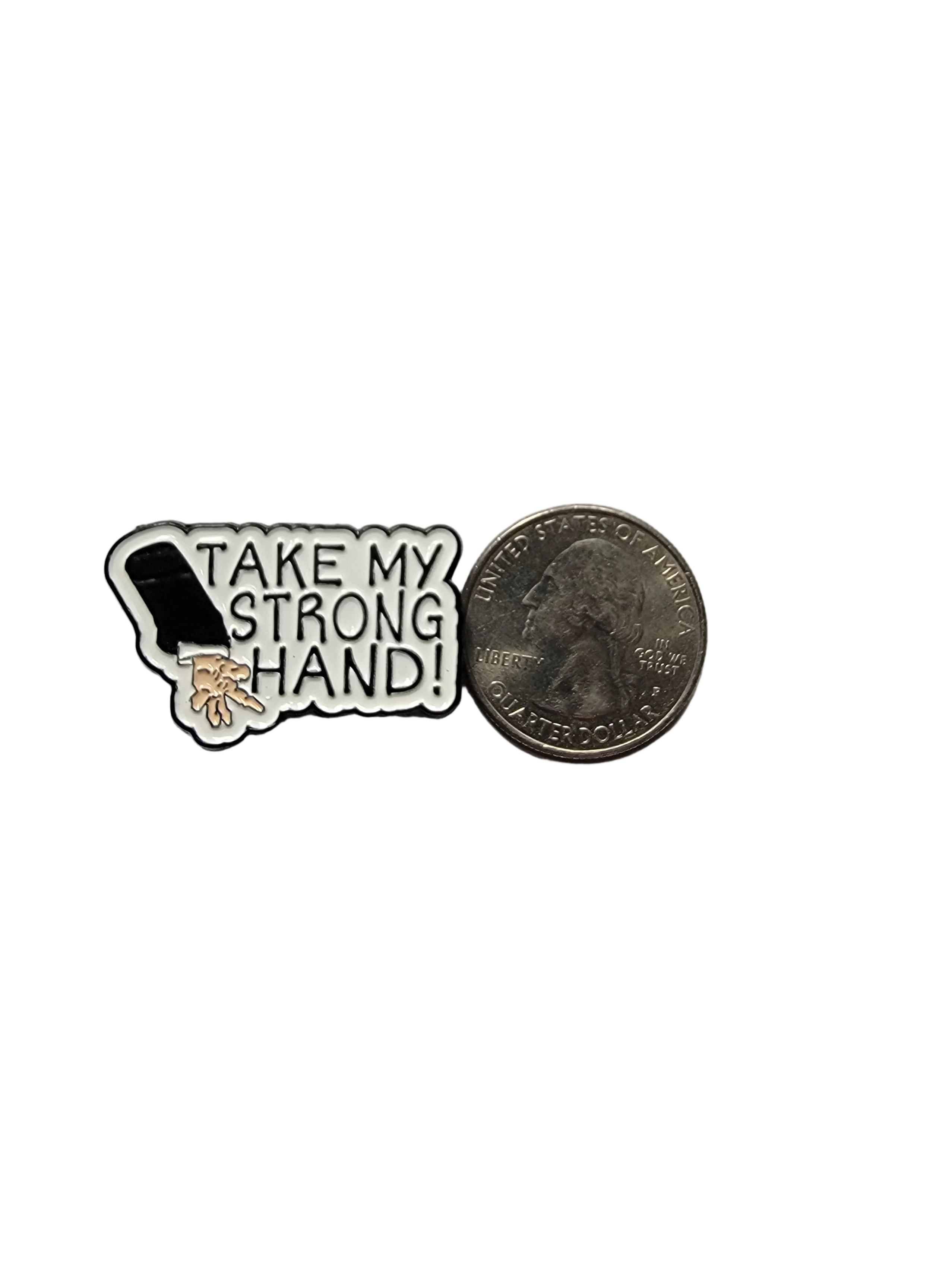 Pin with 'Take My Strong Hand!' text on a white background next to a quarter for size