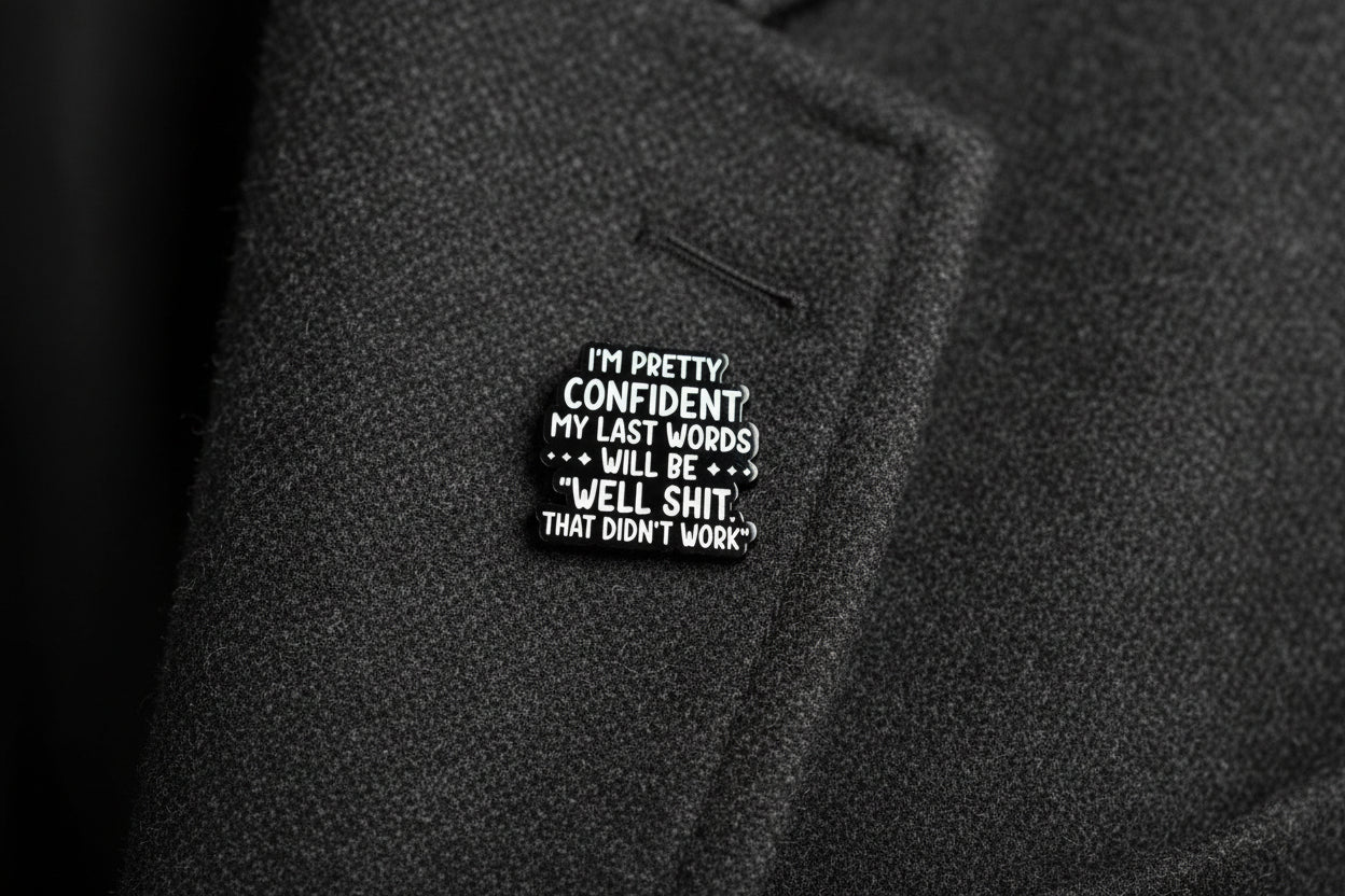 Black and white text badge on a gray background