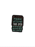 Enamel pin with text on a white background