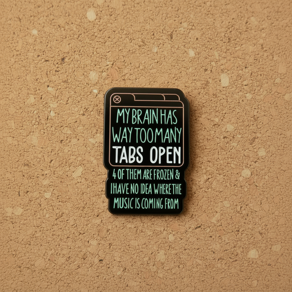 My brain has too many tabs open 4 of them are frozen & i have no idea where the music is coming from enamel pin displayed on cork board sassy enamel pin for collectors and display