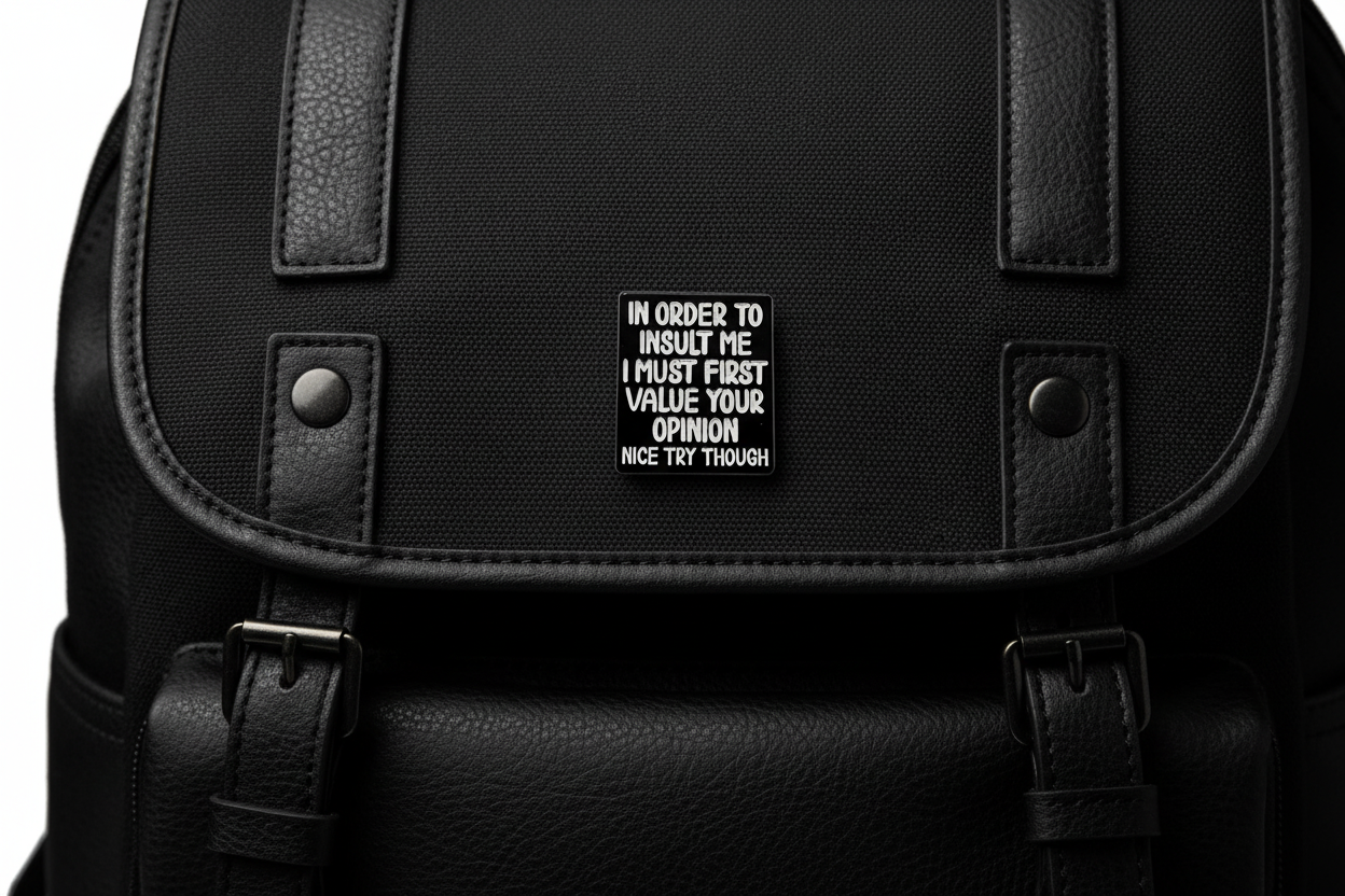 Black square with white text on a black fabric background