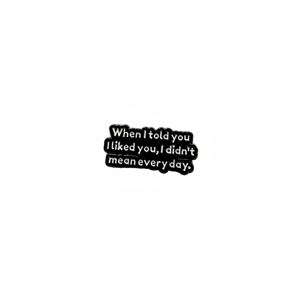 black enamel pin with white text and a sarcastic saying on a white background