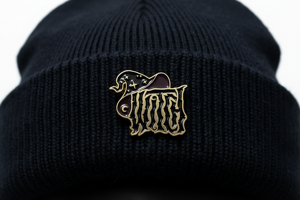 witch enamel pin worn on beanie hat alternative enamel pin for casual outfits and street wear