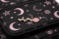 witchy broom enamel pin on backpack pastel goth accessory for customizing bags and school gear