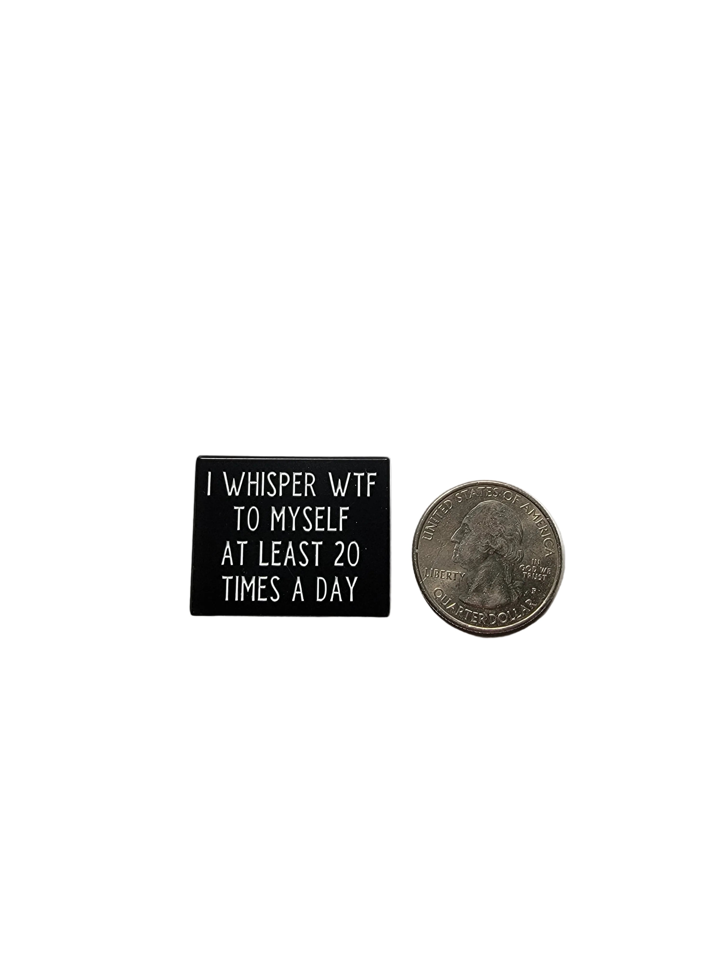 Small black box with text on a gray surface with a coin for scale